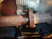 With a 13mm socket, remove the nuts at the catalytic converter flange